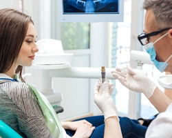 dentist explaining dental implant process