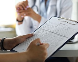 a patient filling out forms