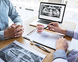 a patient consulting with a dentist