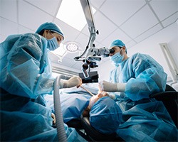 a dentist placing a dental implant