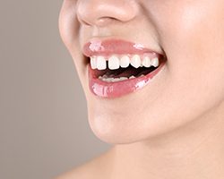 Nose-to-chin ¾ profile view of woman with diastema smiling